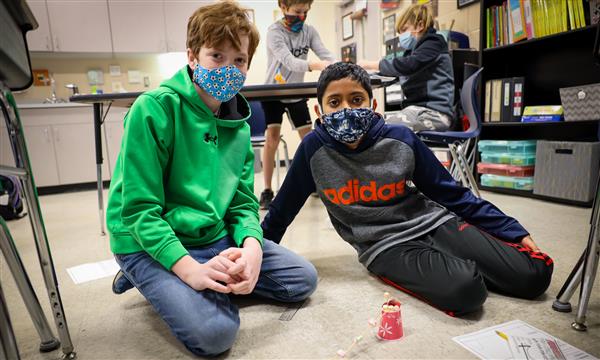 students work to build a bridge